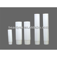 White cosmetic tube with ribbed cap